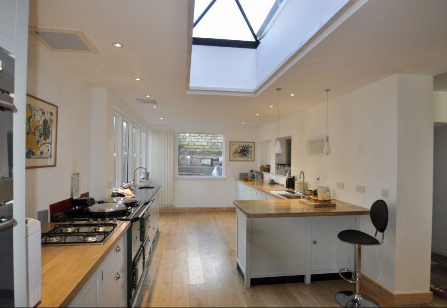 Kitchen Extension - O2i Design Consultants Transformed family property with a sleek kitchen extension blending seamlessly with the historic building. Premium oak, slim frames, exceptional insulation.