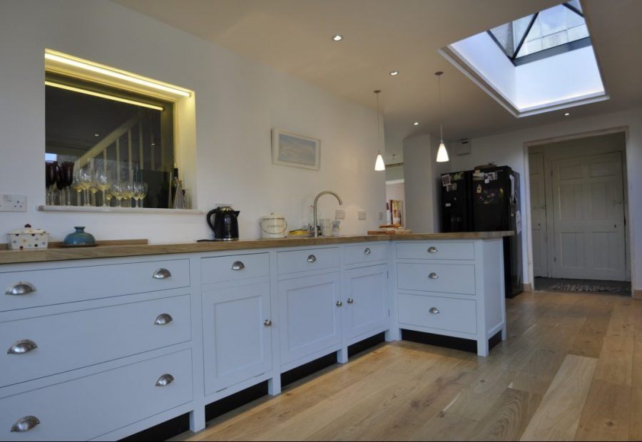 Kitchen Extension - O2i Design Consultants Transformed family property with a sleek kitchen extension blending seamlessly with the historic building. Premium oak, slim frames, exceptional insulation.