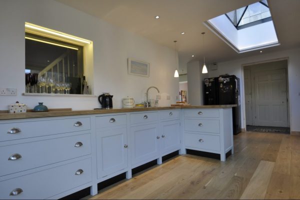 Kitchen Extension - O2i Design Consultants Transformed family property with a sleek kitchen extension blending seamlessly with the historic building. Premium oak, slim frames, exceptional insulation.