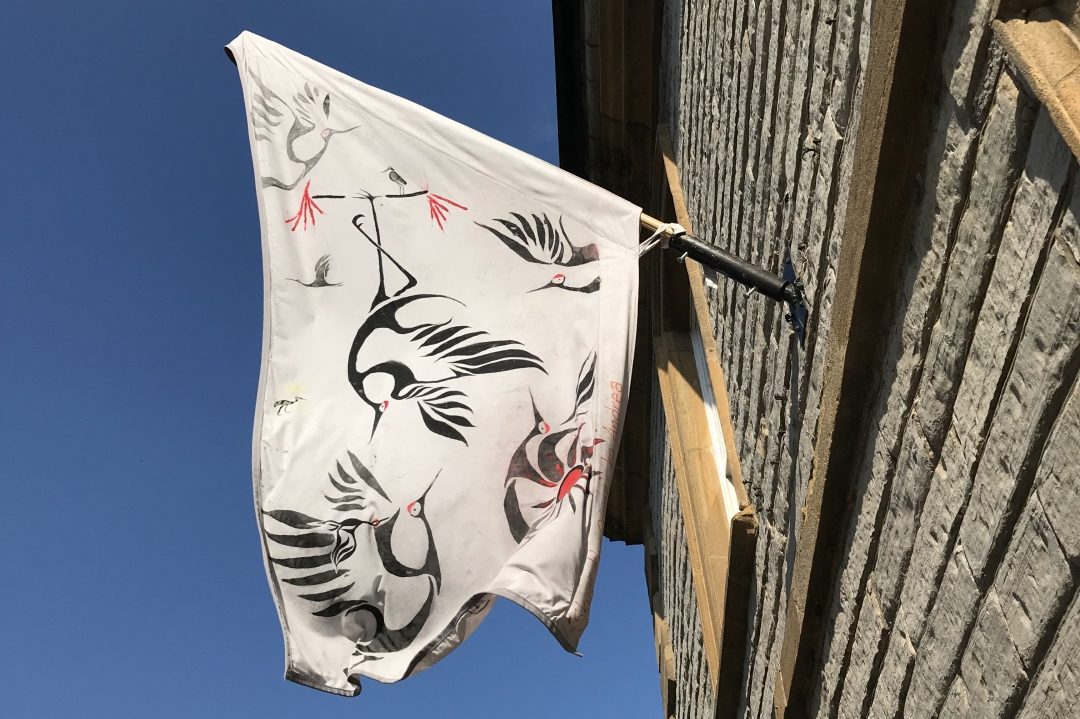 Langport Flags: Created by O2i Design - O2i Design Consultants Langport High Street brightens up with the Langport Flags in the summer. This year, we had the honour of designing & painting our own flag.